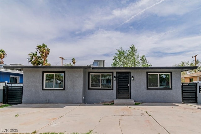244 N 19th St, Las Vegas, NV 89101 - view of front of house with stucco siding and a patio area