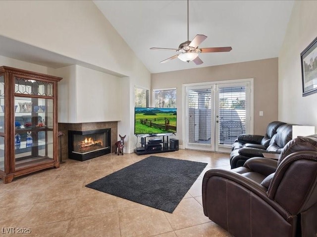 8961 Clairton Ct, Las Vegas, NV 89117 - living area with tile patterned floors, a multi sided fireplace, ceiling fan, and high vaulted ceiling