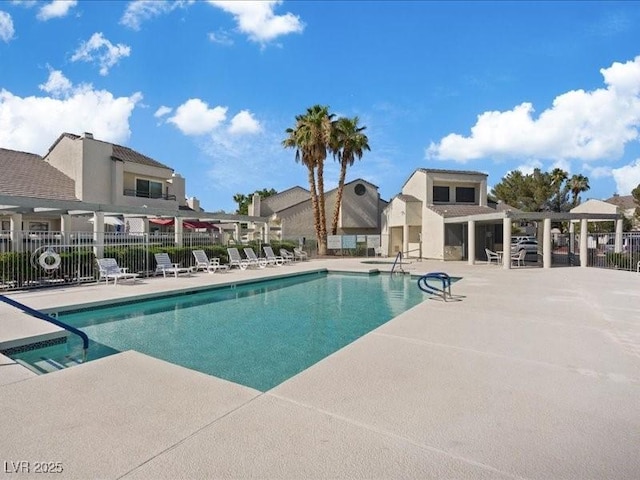 8961 Clairton Ct, Las Vegas, NV 89117 - community pool featuring a patio area and a residential view