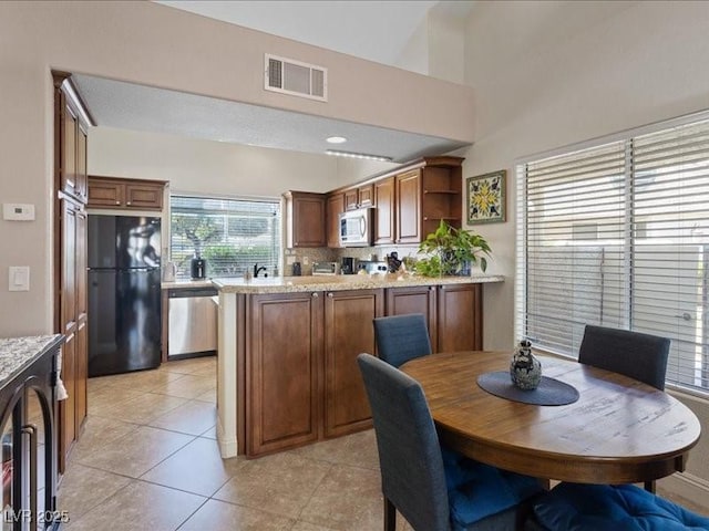 8961 Clairton Ct, Las Vegas, NV 89117 - dining area with light tile patterned floors