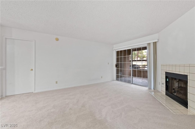 2200 S Fort Apache Rd Unit 1114, Las Vegas, NV 89117 - unfurnished living room featuring a textured ceiling, carpet floors, and a tile fireplace