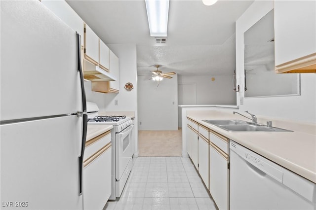 2200 S Fort Apache Rd Unit 1114, Las Vegas, NV 89117 - kitchen with white appliances, light countertops, ceiling fan, light tile patterned floors, and white cabinetry