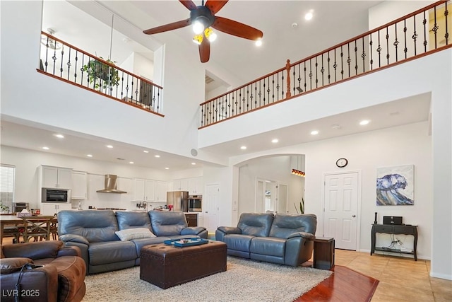 10500 Eagle Nest St, Las Vegas, NV 89141 - living area with a high ceiling, ceiling fan, arched walkways, light tile patterned floors, and recessed lighting