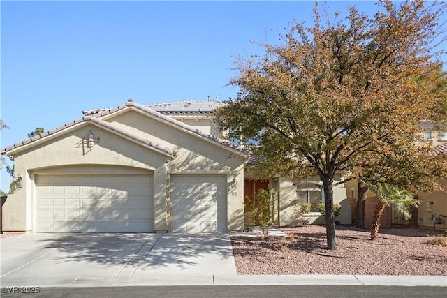 10500 Eagle Nest St, Las Vegas, NV 89141 - view of front of property featuring a garage, concrete driveway, and stucco siding