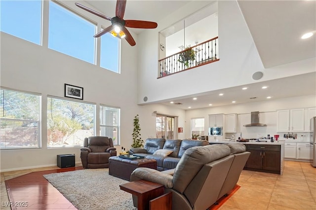 10500 Eagle Nest St, Las Vegas, NV 89141 - living area with a towering ceiling, a ceiling fan, recessed lighting, and light tile patterned floors