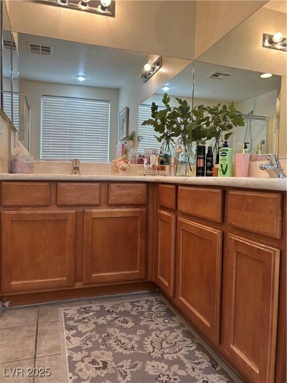 4013 Kindhearted Ct, North Las Vegas, NV 89032 - full bath with double vanity, tile patterned floors, and a shower