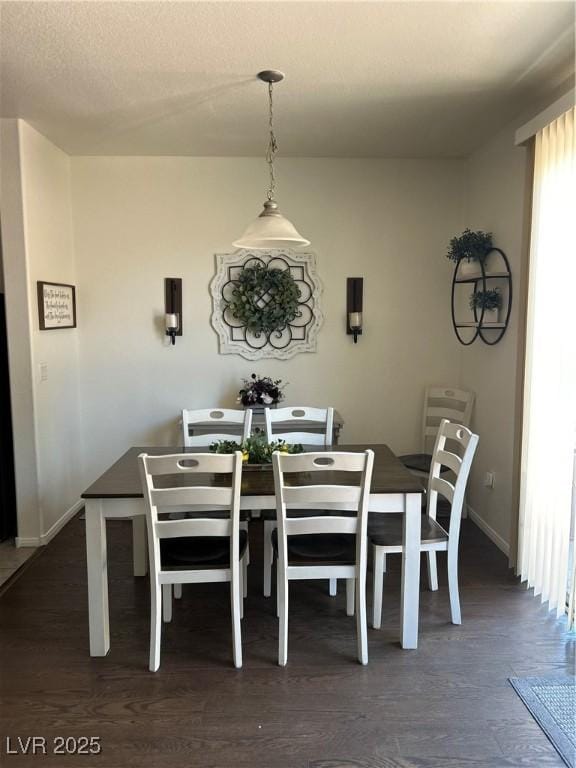 4013 Kindhearted Ct, North Las Vegas, NV 89032 - dining room featuring baseboards and dark wood-type flooring