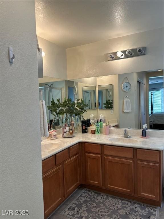 4013 Kindhearted Ct, North Las Vegas, NV 89032 - full bathroom with double vanity and a textured wall