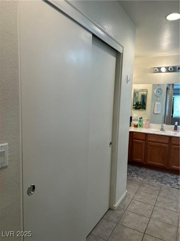 4013 Kindhearted Ct, North Las Vegas, NV 89032 - bathroom featuring vanity and tile patterned flooring