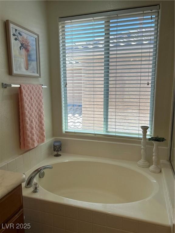 4013 Kindhearted Ct, North Las Vegas, NV 89032 - bathroom featuring a bath, vanity, and plenty of natural light