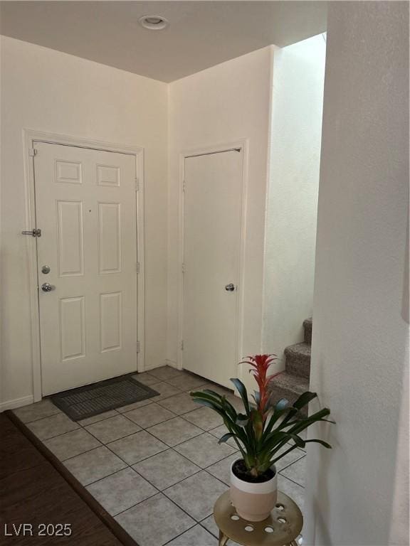 4013 Kindhearted Ct, North Las Vegas, NV 89032 - foyer entrance with light tile patterned floors and stairs