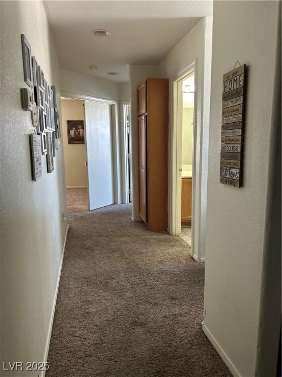 4013 Kindhearted Ct, North Las Vegas, NV 89032 - hallway with carpet floors and baseboards
