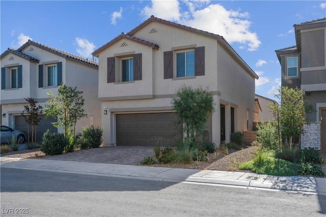 7104 Stockton Dunes St, North Las Vegas, NV 89084 - mediterranean / spanish house featuring stucco siding, an attached garage, driveway, and a tile roof