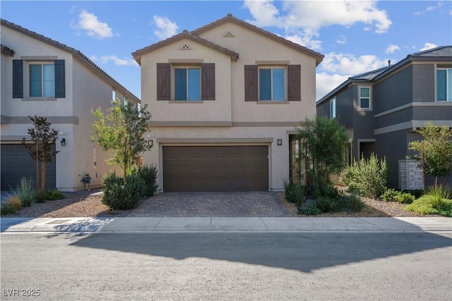 7104 Stockton Dunes St, North Las Vegas, NV 89084 - view of front facade with stucco siding, an attached garage, driveway, and a tile roof