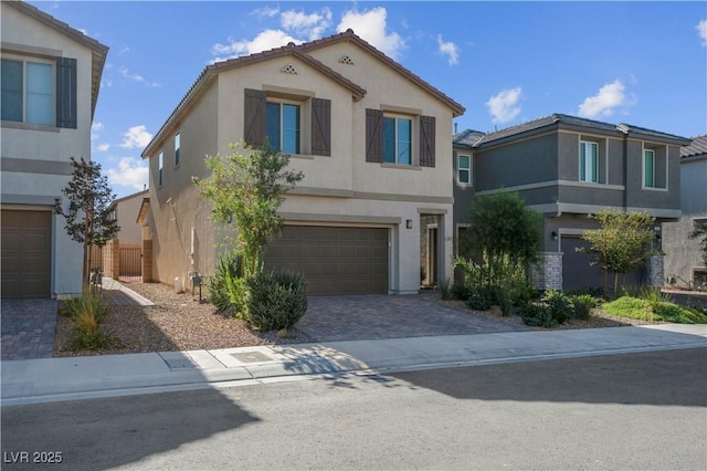 7104 Stockton Dunes St, North Las Vegas, NV 89084 - view of front of property with stucco siding, an attached garage, and decorative driveway