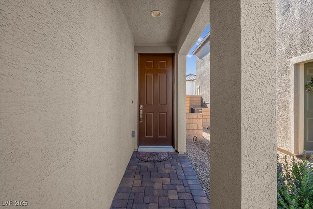7104 Stockton Dunes St, North Las Vegas, NV 89084 - doorway to property featuring stucco siding