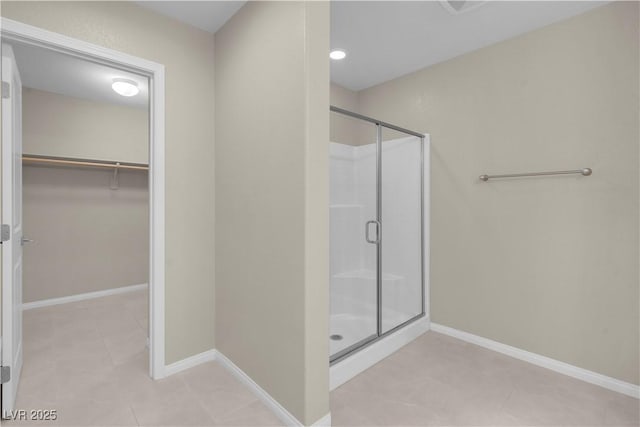 7104 Stockton Dunes St, North Las Vegas, NV 89084 - full bath featuring a stall shower, a spacious closet, and tile patterned flooring