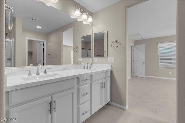 7104 Stockton Dunes St, North Las Vegas, NV 89084 - bathroom with double vanity, tile patterned floors, and an enclosed shower
