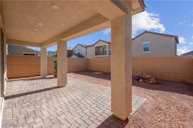 7104 Stockton Dunes St, North Las Vegas, NV 89084 - fenced backyard with a patio