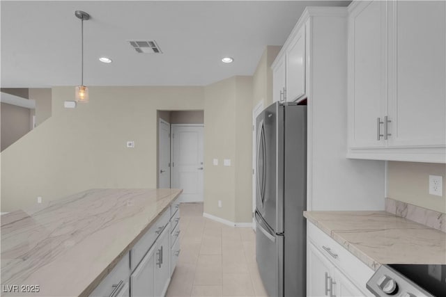 7104 Stockton Dunes St, North Las Vegas, NV 89084 - kitchen featuring freestanding refrigerator, white cabinets, recessed lighting, pendant lighting, and stove