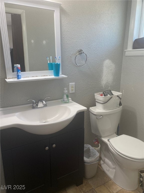 27 Carson Ct, Ely, NV 89301 - bathroom featuring vanity and a textured wall