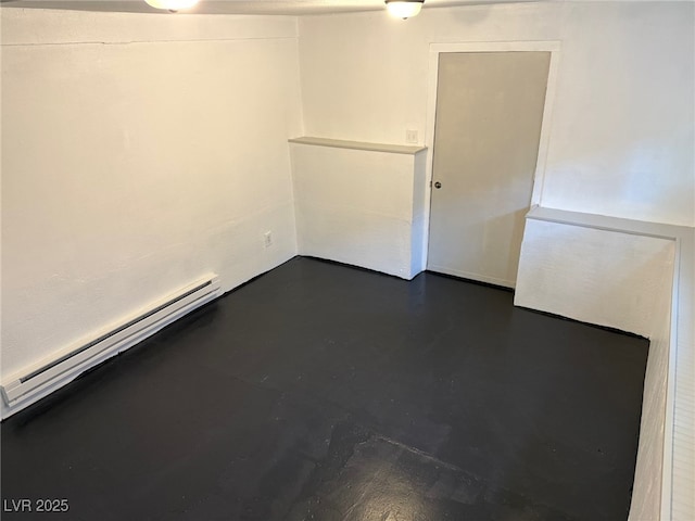 27 Carson Ct, Ely, NV 89301 - unfurnished room featuring a baseboard heating unit and finished concrete floors