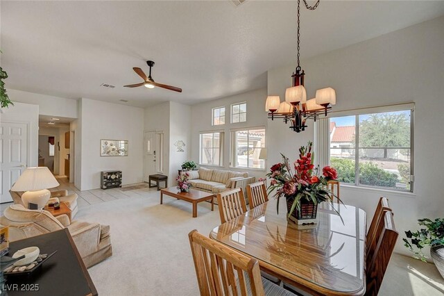 1734 Marshall Dr, Henderson, NV 89014 - dining room featuring a chandelier, ceiling fan, and light carpet