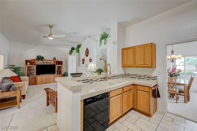 1734 Marshall Dr, Henderson, NV 89014 - kitchen with black dishwasher, open floor plan, light colored carpet, light countertops, and a chandelier