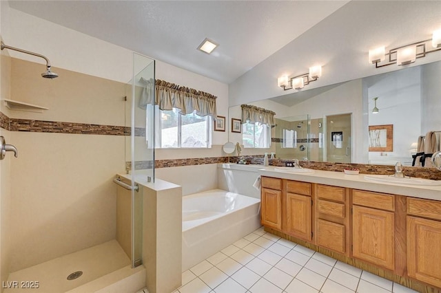1734 Marshall Dr, Henderson, NV 89014 - bathroom featuring a shower stall, a garden tub, tile patterned floors, lofted ceiling, and double vanity