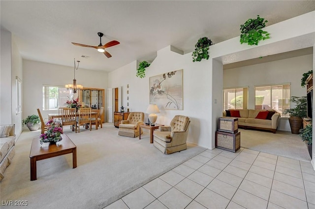 1734 Marshall Dr, Henderson, NV 89014 - living room with light colored carpet, ceiling fan, a chandelier, and light tile patterned floors