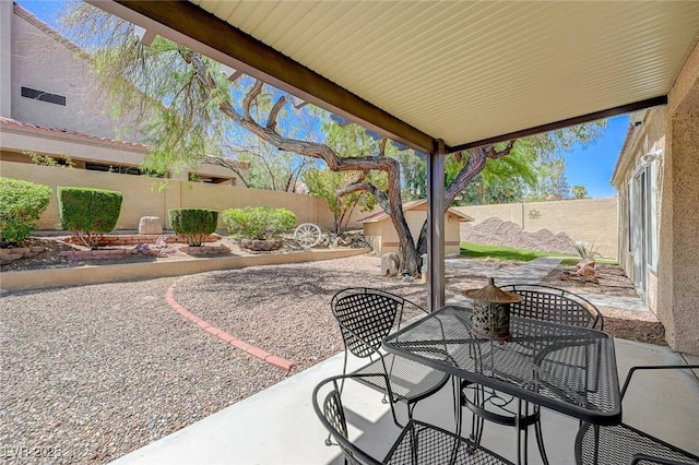 1734 Marshall Dr, Henderson, NV 89014 - fenced backyard with a patio area and outdoor dining space