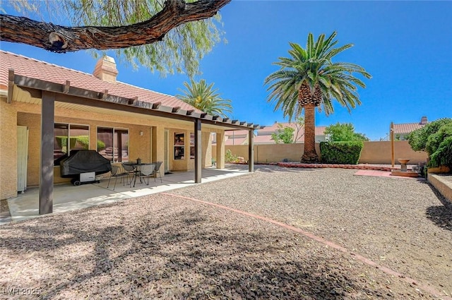 1734 Marshall Dr, Henderson, NV 89014 - rear view of property with a chimney, a fenced backyard, a patio, and stucco siding