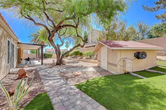 1734 Marshall Dr, Henderson, NV 89014 - view of yard featuring a patio and an outdoor structure
