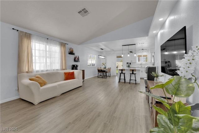 7316 Young Doe Ave, Las Vegas, NV 89130 - living room featuring light wood-style flooring, lofted ceiling, and recessed lighting