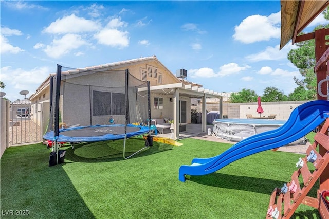 7316 Young Doe Ave, Las Vegas, NV 89130 - back of property featuring a trampoline, a playground, a pergola, and a fenced backyard
