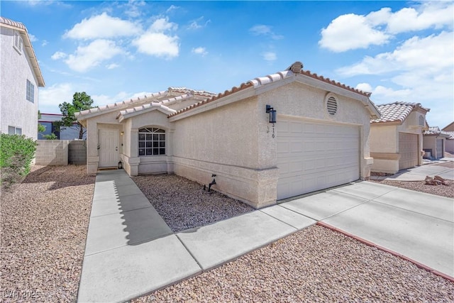 7316 Young Doe Ave, Las Vegas, NV 89130 - mediterranean / spanish house with a tile roof, an attached garage, stucco siding, and driveway