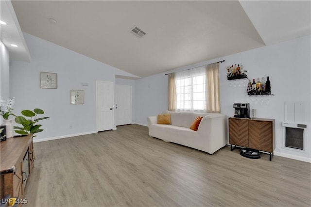 7316 Young Doe Ave, Las Vegas, NV 89130 - living area featuring light wood finished floors and lofted ceiling