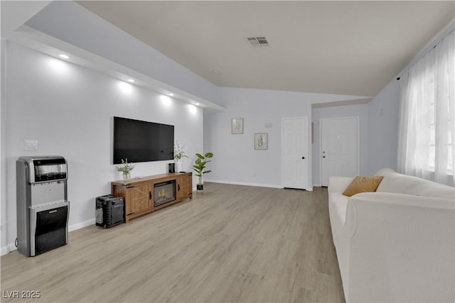 7316 Young Doe Ave, Las Vegas, NV 89130 - living room featuring light wood-type flooring, vaulted ceiling, and recessed lighting