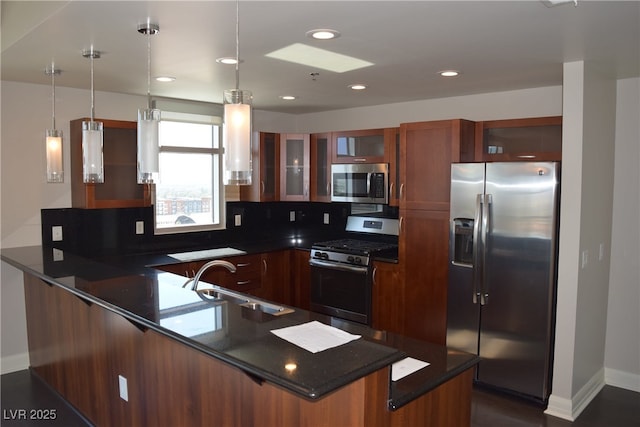 150 N Las Vegas Blvd Unit 1217, Las Vegas, NV 89101 - kitchen with stainless steel appliances, a peninsula, glass insert cabinets, pendant lighting, and dark stone countertops