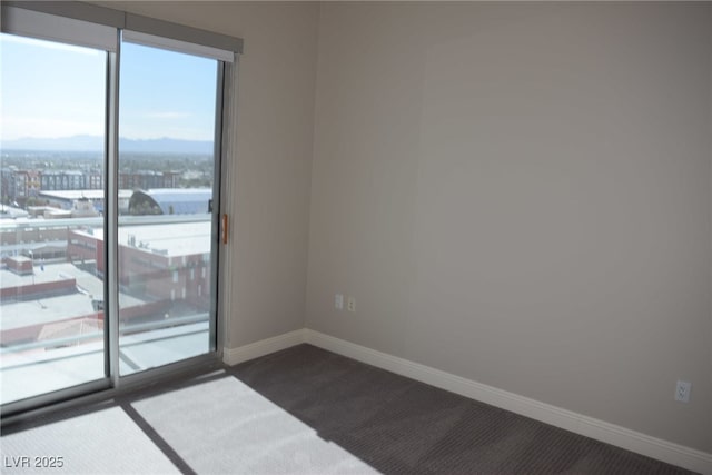 150 N Las Vegas Blvd Unit 1217, Las Vegas, NV 89101 - empty room featuring dark colored carpet and baseboards