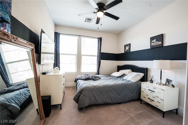 9584 Jadeite Ln, Las Vegas, NV 89143 - carpeted bedroom with multiple windows and a ceiling fan