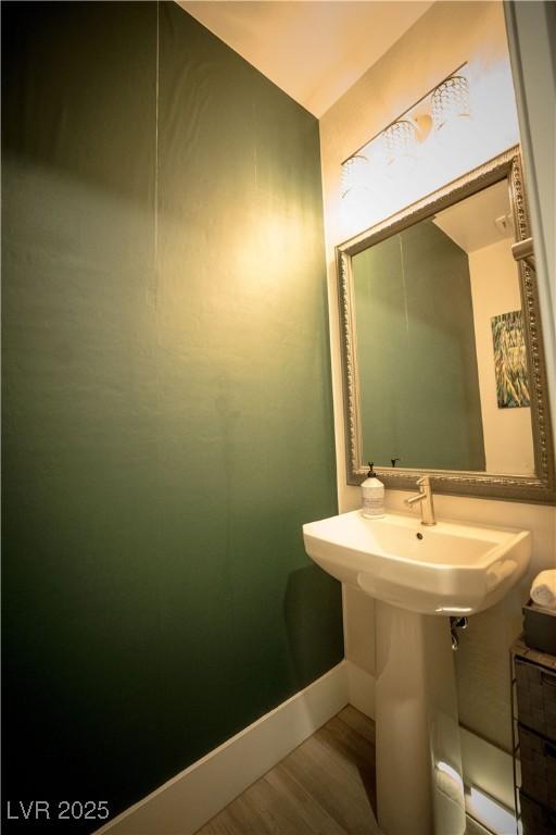 9584 Jadeite Ln, Las Vegas, NV 89143 - bathroom featuring wood finished floors and baseboards
