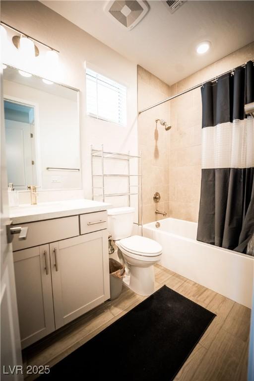 9584 Jadeite Ln, Las Vegas, NV 89143 - bathroom with vanity, shower / tub combo with curtain, and wood finished floors