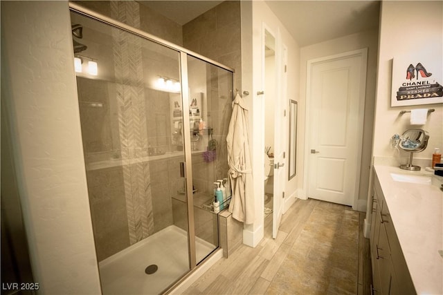 9584 Jadeite Ln, Las Vegas, NV 89143 - full bath featuring a shower stall, vanity, and wood finished floors