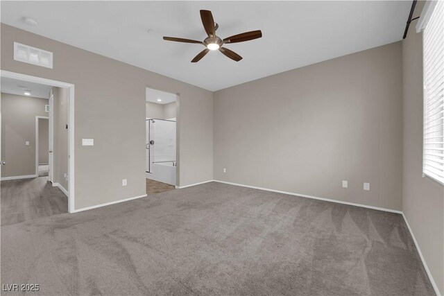 8520 Insignia Ave Unit 104, Las Vegas, NV 89178 - unfurnished bedroom featuring carpet, ensuite bath, and a ceiling fan