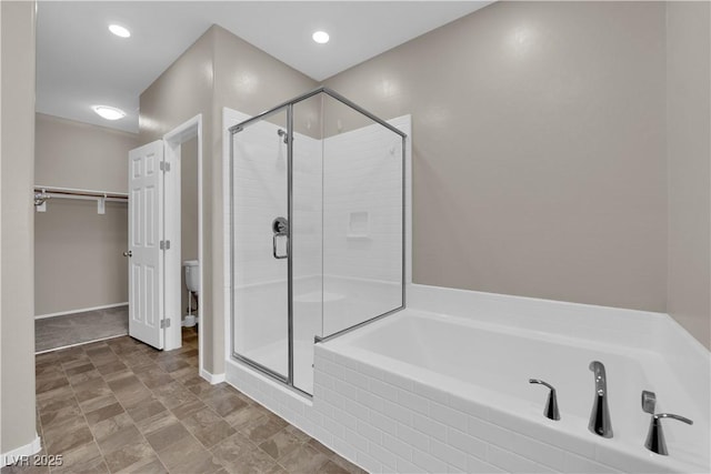 8520 Insignia Ave Unit 104, Las Vegas, NV 89178 - bathroom featuring a garden tub and a stall shower