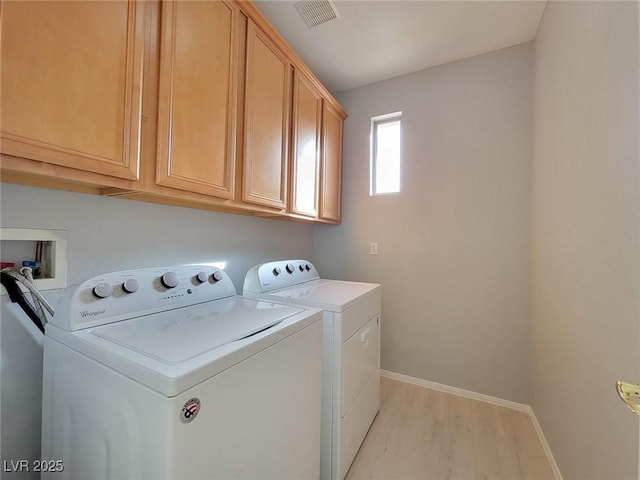 10482 Calico Pines Ave, Las Vegas, NV 89135 - washroom with cabinet space, washing machine and dryer, and light wood finished floors