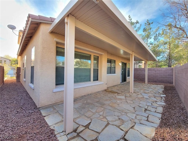 10482 Calico Pines Ave, Las Vegas, NV 89135 - fenced backyard with a patio area