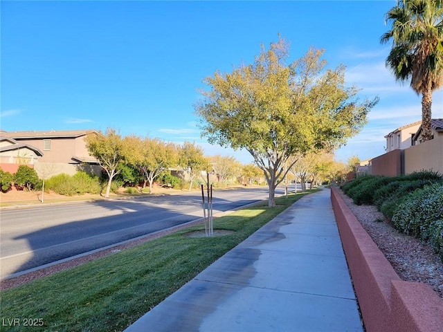 10482 Calico Pines Ave, Las Vegas, NV 89135 - view of asphalt street with sidewalks, a residential view, and curbs