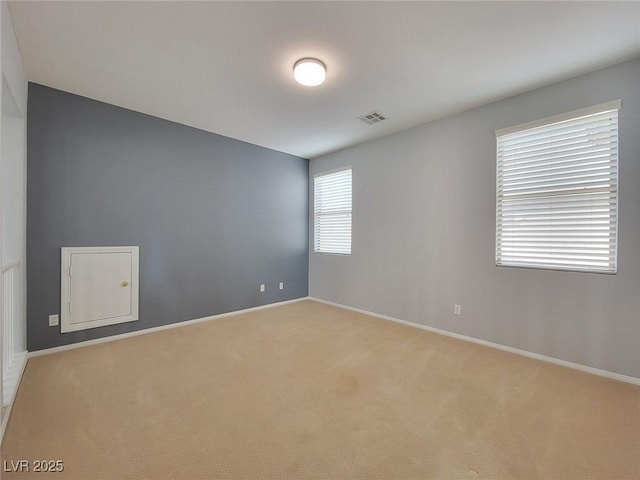 10482 Calico Pines Ave, Las Vegas, NV 89135 - spare room featuring light carpet and baseboards